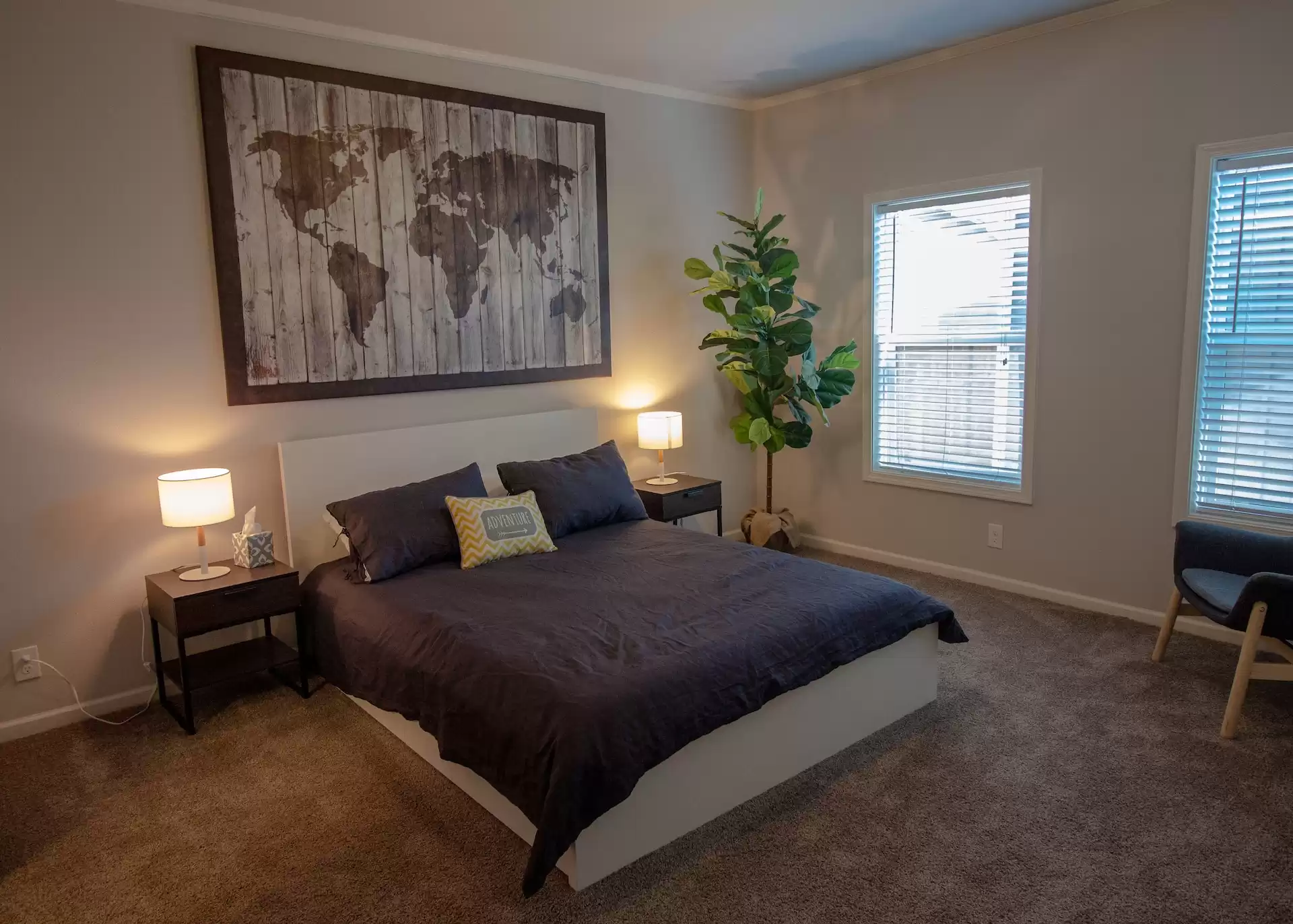 a bedroom featuring furniture rentals, including side tables