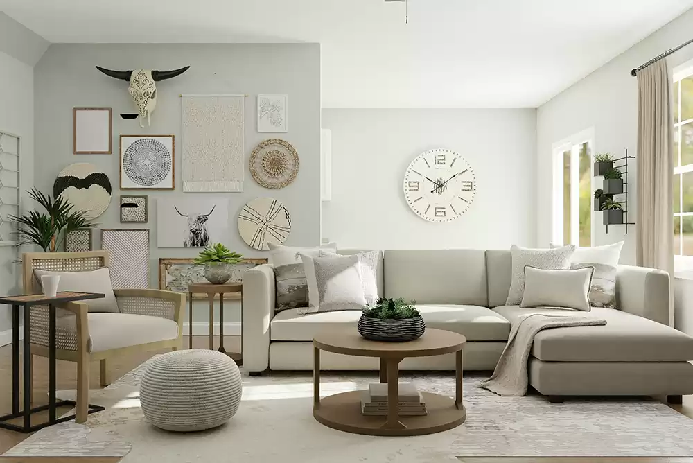 a living space furnished with a white chair, gray couch, brown table, and with decorations on the wall
